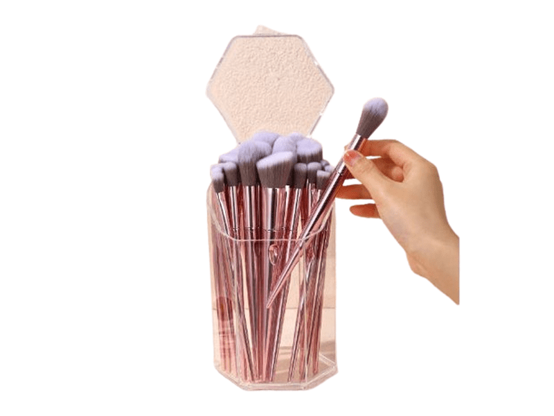 Boîte de rangement transparente pour pinceaux à maquillage.