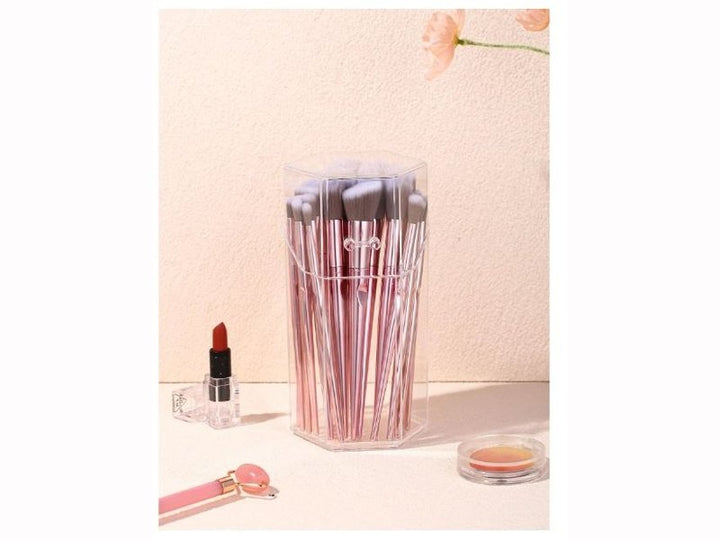 Boîte de rangement transparente pour pinceaux à maquillage.
