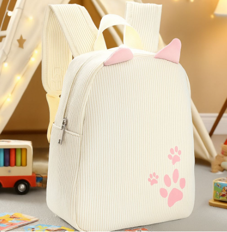 Sac à dos velours côtelé beige rose avec patte de chat brodée disponible sur Dialy en 60min à Dakar